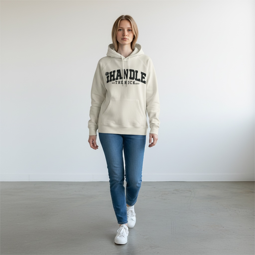 Person wearing a beige hoodie with IHandle text, blue jeans, and white sneakers on a plain background